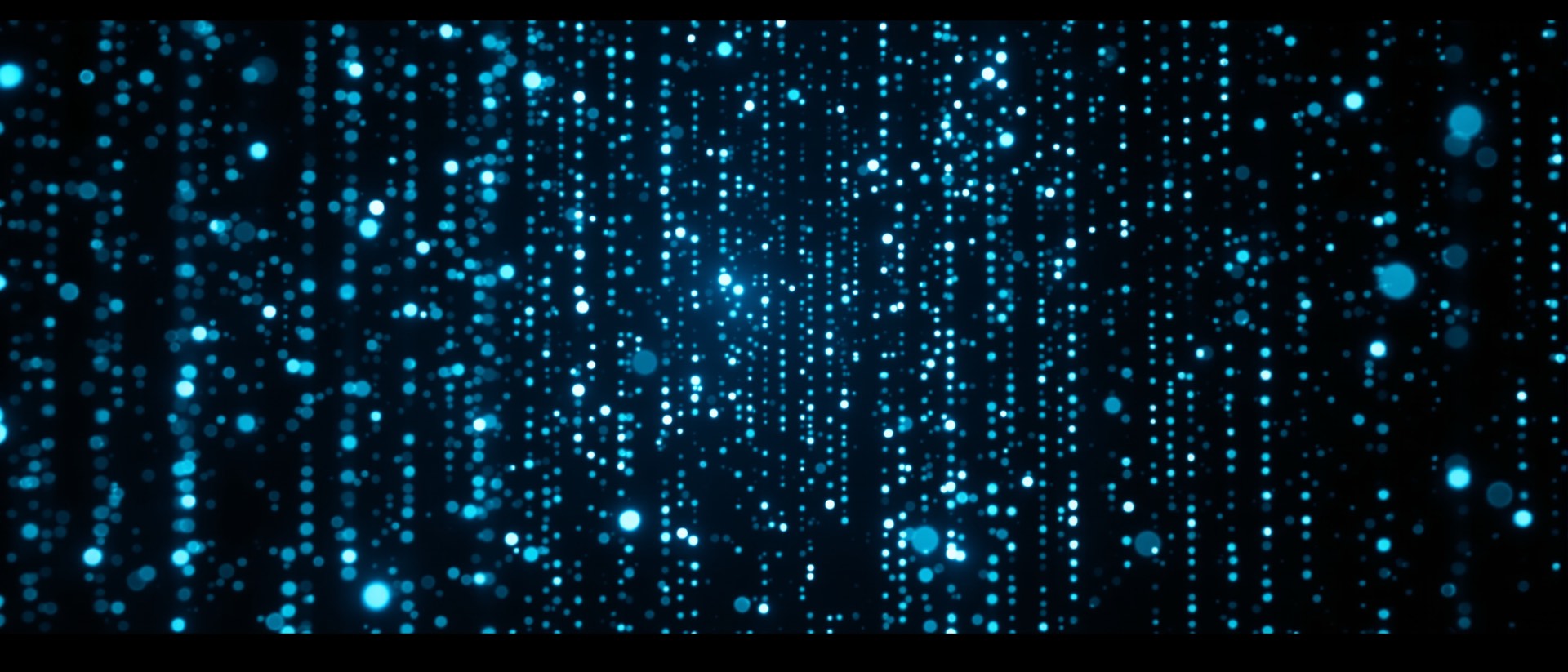 Um enxame de partículas luminosas se organizando em colunas de texto